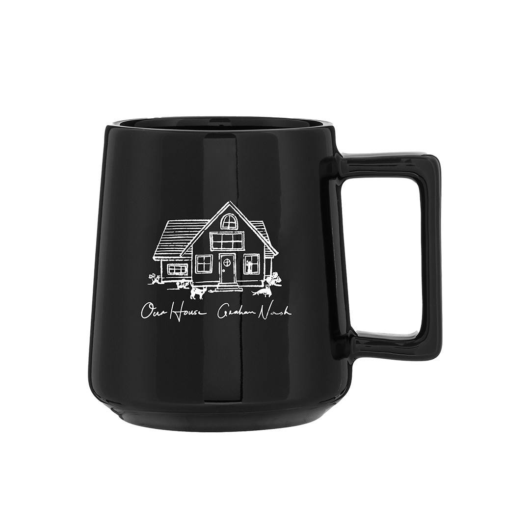 Black mug with a white house illustration and text on a white background